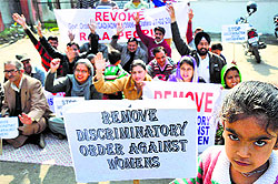 People belonging to the Reserved Backward Area (RBA) category protest against the state government for issuing discriminatory order against RBA women in Jammu on Sunday