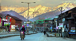 A man out on a motorcycle during a sunny day in Srinagar on Sunday