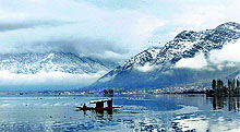 A boatman rows his boat on the Dal Lake in Srinagar