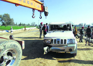 The SUV that slipped into a drain near Sayeedwala village, 12 km from Abohar, on Sunday.