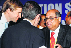 N Ramachandran, the IOAs new president, talks to the IOC observers during the IOA polls in New Delhi on Sunday.
