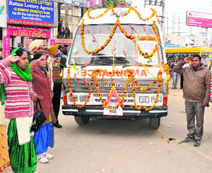 Teachers and city residents bid adieu to Rooths family as they leave for their village in Moga district in an ambulance with the childs body on Monday.