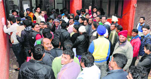 High security registration plate seekers queue up at a sub-office of the RLA in the Industrial Area-I, Chandigarh, on Monday. 