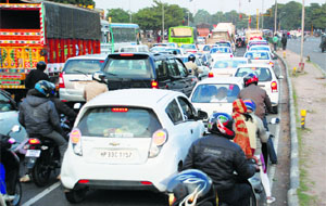 Long queues of vehicles can be seen at the Housing Board light point in Chandigarh.