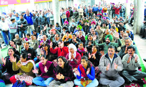 Bank employees hold a protest at Bank Square, Sector 17, Chandigarh, on Monday
