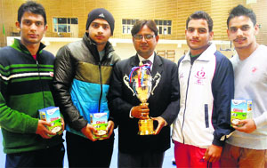 The Panjab University mens judo team with the trophy won by it in the All-India Inter-University Judo Championship.