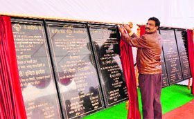 A government employee removes the curtains on the foundation stones of various projects that were to be inaugurated by Minister for Legislative Affairs Indira Hridayesh in Haridwar on Sunday.