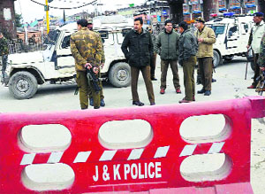 Senior Superintendent of Police Amit Kumar reviews security arrangements during restrictions in Srinagar on Monday. 