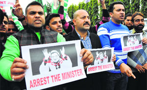 PDP activicts demand immediate arrest of ex-Health Minister Shabir Khan in Jammu on Monday.