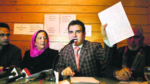 Spokesperson for the Doctors Association of Kashmir Rashid Para shows the statement of the victim during a press conference in Srinagar on Monday.