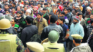 People from different villages under the Baghwah block protest outside the office of the District Development Commissioner, Doda, on Monday.