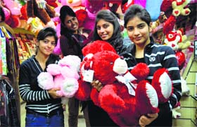 Girls buy gifts on the Teddy Bear Day in Ludhiana on Monday