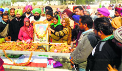 The family members of Eknoor Kaur at her cremation at Bambiha village in Moga on Monday. A Tribune photo