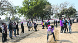 Students of Government Rajindra College prepare the track for an athletics meet in Bathinda on Tuesday. Tribune photo