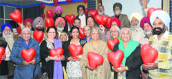 Senior citizens celebrate Valentines Day after the conclusion of a seminar on health at Fortis Hospital in Mohali on Tuesday. Tribune photo: Vicky Gharu