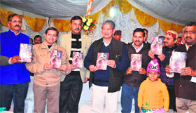 Uttarakhand Chief Minister Harish Rawat releases a book written by journalist Prem Partap Singh in Dehradun on Tuesday.