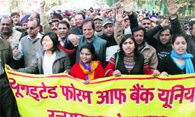 Striking bank employees hold a protest in support of their demands in Dehradun on Tuesday