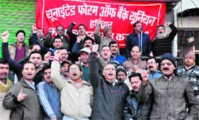 employees demonstrate demanding a wage revision at Ranipur in Haridwar