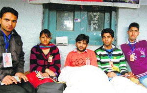 Aditya Sharma (centre), Students Council president, sits on a fast at Dharamsala on Tuesday.