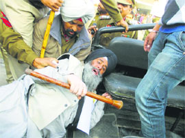 SAD (A) leader Rajinder Singh Fauji being taken away by the police in Phagwara on Tuesday