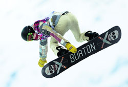 Shaun White of the U.S. performs a jump during the men's snowboard halfpipe qualification round