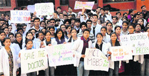 MBBS students of the GMCH-32 stage a protest on the college campus in Chandigarh on Wednesday. 