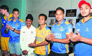 The Punjab Warriors team pose with Japtej Singh (in white) at Yadavindra Public School in Mohali on Wednesday.