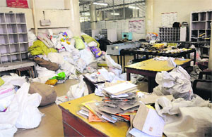 Heaps of letters lying at the General Post Office as postal staff went on a two-day strike in Sector 17, Chandigarh, on Wednesday. 