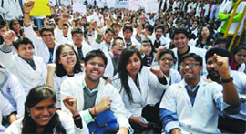 Students raise slogans against the Medical Council of India at Nirman Bhawan in New Delhi on Wednesday.