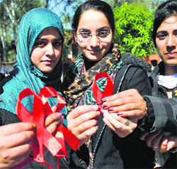 Students of Government College for Women, Gandhi Nagar, participate in an AIDS awareness rally in Jammu on Wednesday