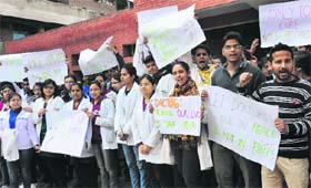 MBBS students of the GMCH, Sector 32, hold a protest during their nationwide strike, in Chandigarh on Thursday