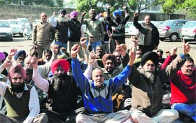 Up in arms: Employees protest at the General Post Office in Sector 17, Chandigarh, during their two-day strike on Thursday