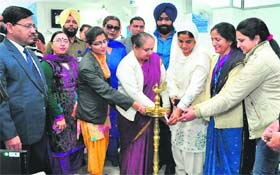Chairperson of the Punjab Women Commission, Paramjit Kaur Landran (third from right), inaugurates an SBI branch in Mohali on Thursday