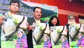 Cabinet Minister Harak Singh Rawat (second from left) releases a poster on sustainable development at a seminar in Dehradun on Thursday.