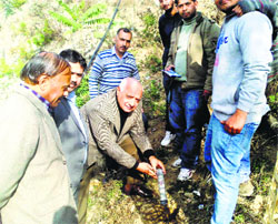 Career Point University Vice-Chancellor PL Gautam installs a soil gas meter on the campus in Mandi. 