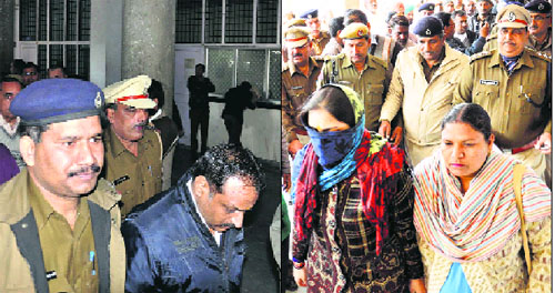 The father-in-law (left) and wife of Akhil Chauhan proceed to a local court in Karnal on Thursday.