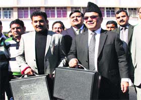Finance Minister Abdul Rahim Rather on his way to the Legislative Assembly to present the annual Budget on Thursday