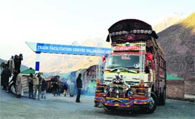 Pakistani trucks leave the trade faciltation centre at Salamabad in Uri