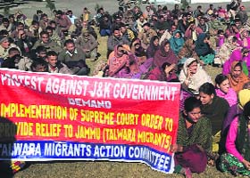 Migrants from Talwara protest at the Deputy Commissioners Office in Reasi on Thursday