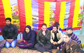 Members of social organisations hold a protest in Doda on Thursday
