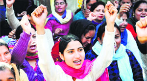 Multi-purpose health workers hold a protest in Ludhiana on Thursday.