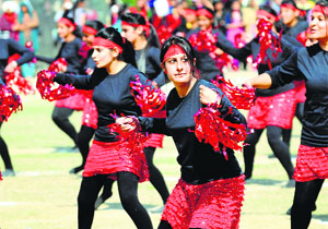 Girls perform aerobics. 
