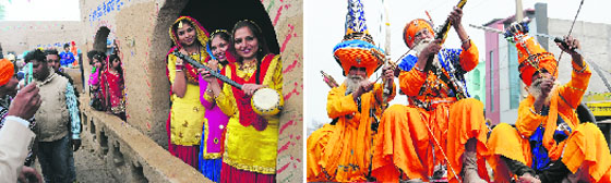 Girls dressed up in traditional clothes with a tumbi; and (below) Nihangs in a tableau during a procession of the Virasat Mela in Bathinda on Friday. Tribune photos