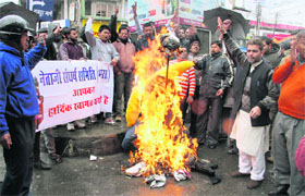 Members of the Netaji Sangharsh Samiti burn an effigy at Clock Tower in Dehradun on Friday in protest against the Valentines Day celebrations.