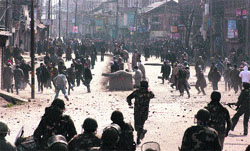 Protesters throw stones at security forces personnel during the 2010 summer unrest in the Valley. Tribune file photo: Amin War