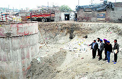 MC's Zone B Commissioner Kamlesh Bansal inspects the under construction sewerage project in Ludhiana on Friday