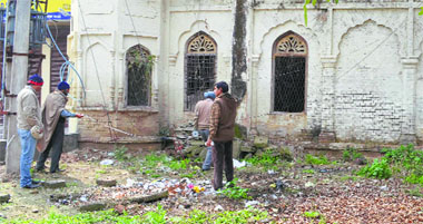 Officials demarcate the vacated complex in Bassi Pathana on Friday