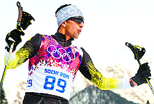 Nadeem Iqbal crosses the finish line in the mens cross-country skiing 15km classic during the Sochi Olympics on Friday
