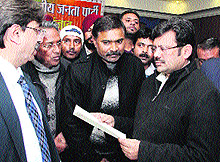 Members of Kanojia Maha Sabha give a memorandum to BJP state president Kamal Sharma against the sale of Dhobi Ghat in Jalandhar on Saturday