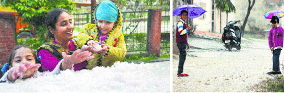 Children play with hails in the Sarabha Nagar area of Ludhiana on Saturday.